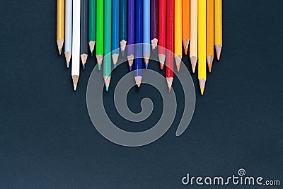 Back to school Concept. Close up shot of color pencil pile pencil nibs on black background with copy space Stock Photo