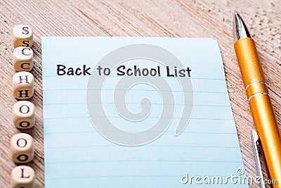 Back to School List concept on notebook and wooden board Stock Photo