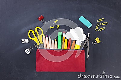 Back to school concept. Pencil case on blackboard Stock Photo