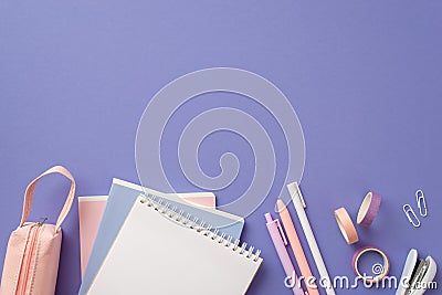 Back to school concept. Top view photo of notebooks pens adhesive tape stapler clips and pink pencil-case on isolated lilac Stock Photo