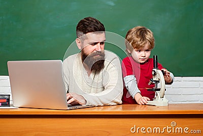 Back to school and Education concept. Father and son. Parent Teacher. First day in school. father teaching her son in Stock Photo