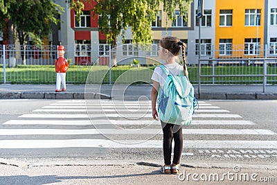 Back to school education concept with girl kids, elementary students, carrying backpacks going to class Stock Photo
