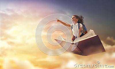 Child flying on the book Stock Photo