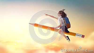 Child flying on a pencil Stock Photo