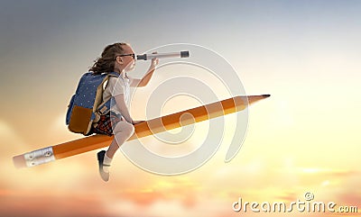 Child flying on a pencil Stock Photo