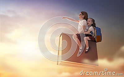 Children flying on the book Stock Photo