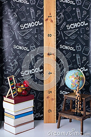 Back to school. Interior of elementary school. Chalkboard, Books, globe and stationery on classroom. Teachers Day concept. Empty c Stock Photo