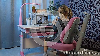 Back to school, online learning for kids, child girl distance lesson education at home with teacher Stock Photo