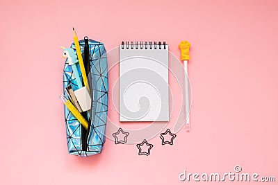 Back to school. Pencil case with school supplies on pink table Stock Photo