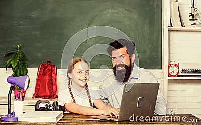 Back to school. study online. small child with bearded teacher man use laptop. innovative technology in modern school Stock Photo