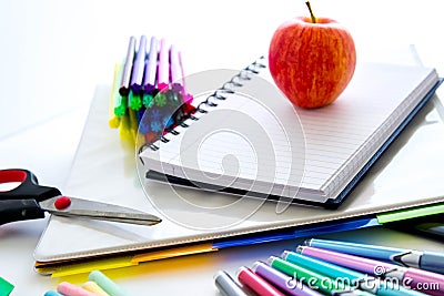 Back to school supplies and an apple for the teacher Stock Photo