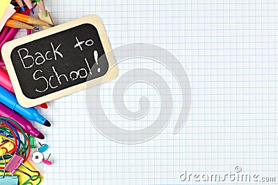 Back to School tag with school supplies on graphing paper Stock Photo