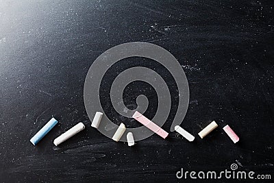 Back to school texture on blackboard with colorful chalks. Stock Photo