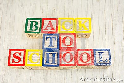 Back to school written in wooden cubicle letters Stock Photo