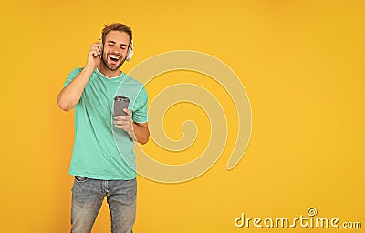 back to school. young guy in headphones drink coffee. music lover. listen to music. Stock Photo