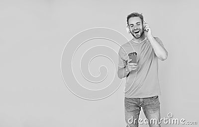 back to school. young guy in headphones drink coffee. music lover. listen to music. Stock Photo