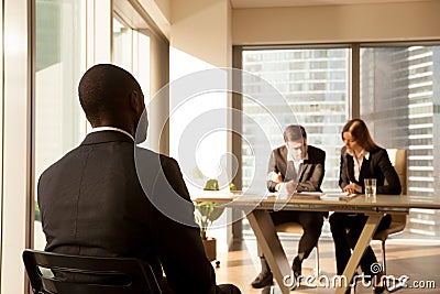 Back view at african-american applicant waiting for job intervie Stock Photo