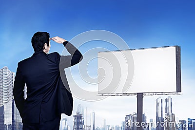 Back view of asian businessman looking at the empty billboard for copyspace Stock Photo