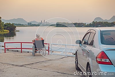 Back view of Asian elderly female patient wearing surgical mask and sitting on wheelchair with feeling lonely and depressed at Editorial Stock Photo
