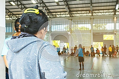 Back view of asian parents cheering childrens learn to playing volleyball Editorial Stock Photo