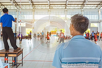 Back view of asian parents cheering childrens learn to playing volleyball Editorial Stock Photo