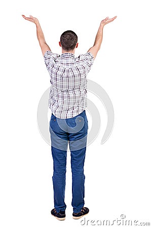 Back view of Beautiful man in jeans looking at wall and Holds h Stock Photo