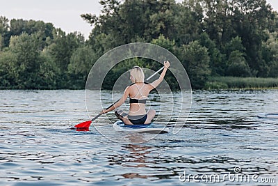 back view of blonde sportswoman Stock Photo