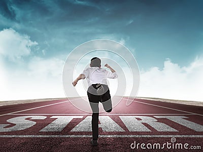 Back view of business man running from start line Stock Photo