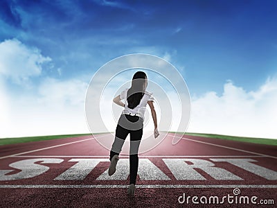 Back view of business woman running from start line Stock Photo