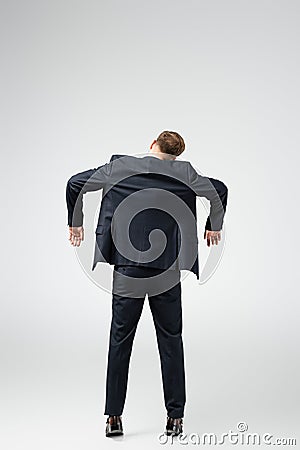 Back view of businessman marionette in Stock Photo
