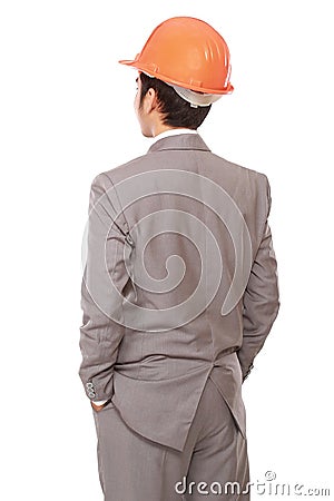 Back view of businessman in orange builder's helmet Stock Photo