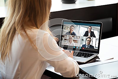 Female employee have team web conference on laptop Stock Photo