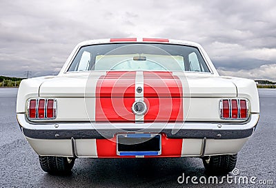 Back view of a classic Ford Mustang 1965 on display at a classic car meeting Stock Photo