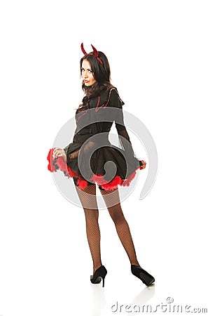 Back view of devil woman turns to the camera Stock Photo