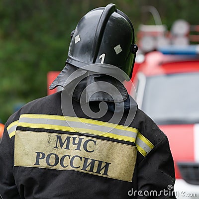 Back view with emblem Emercom of Russia on uniform rescuers of Ministry of Civil Defence, Emergencies and Disaster Relief of Editorial Stock Photo