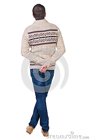 Back view of handsome man in warm sweater looking up. Stock Photo
