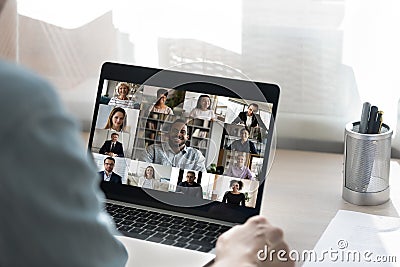 Back view of male employee have webcam conference with colleagues Stock Photo