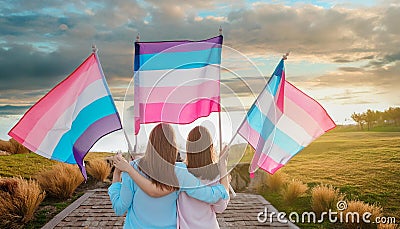 back view of people with LGBT and Trans flags protest on the street. Equality. Freedom Stock Photo