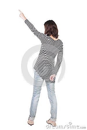 Back view of pointing woman in frock. Stock Photo