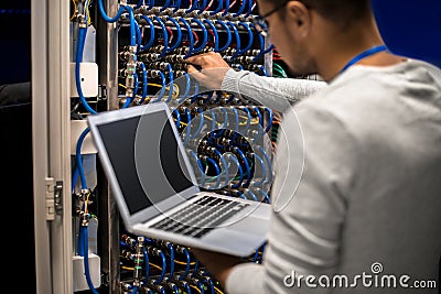 Network Engineer Connecting Servers Stock Photo