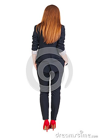Back view of redhead business woman contemplating. Stock Photo