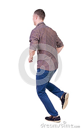 Back view of running man in brown shirt. Stock Photo