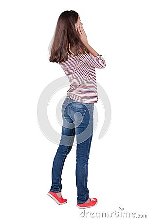 Back view of shocked woman in blue jeans. upset young brunete gi Stock Photo