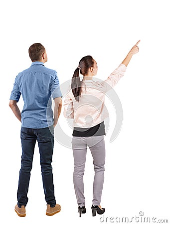 Back view of a stylish couple pointing Stock Photo