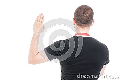 Back view of supermarket seller making a vow Stock Photo