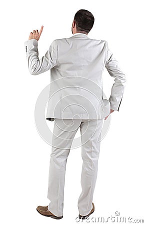 Back view of thinking young business man in white suit. Stock Photo