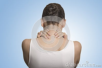 Back view tired female massaging her painful neck Stock Photo