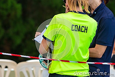 Back view of two female sport swimming coaches discussing about Stock Photo