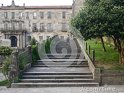 Back view of walking woman tourist on stone stair Editorial Stock Photo