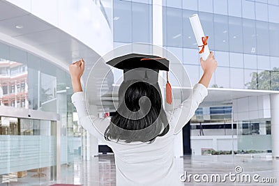Back view of woman celebrating her graduation Stock Photo